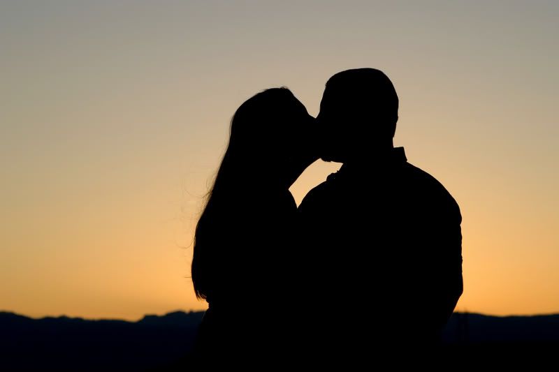 couple kissing sunset. couple kissing sunset.