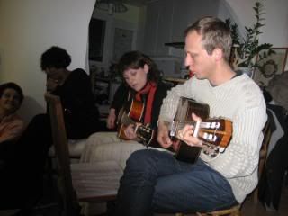 Playing quitar and French songs at Claudine's party